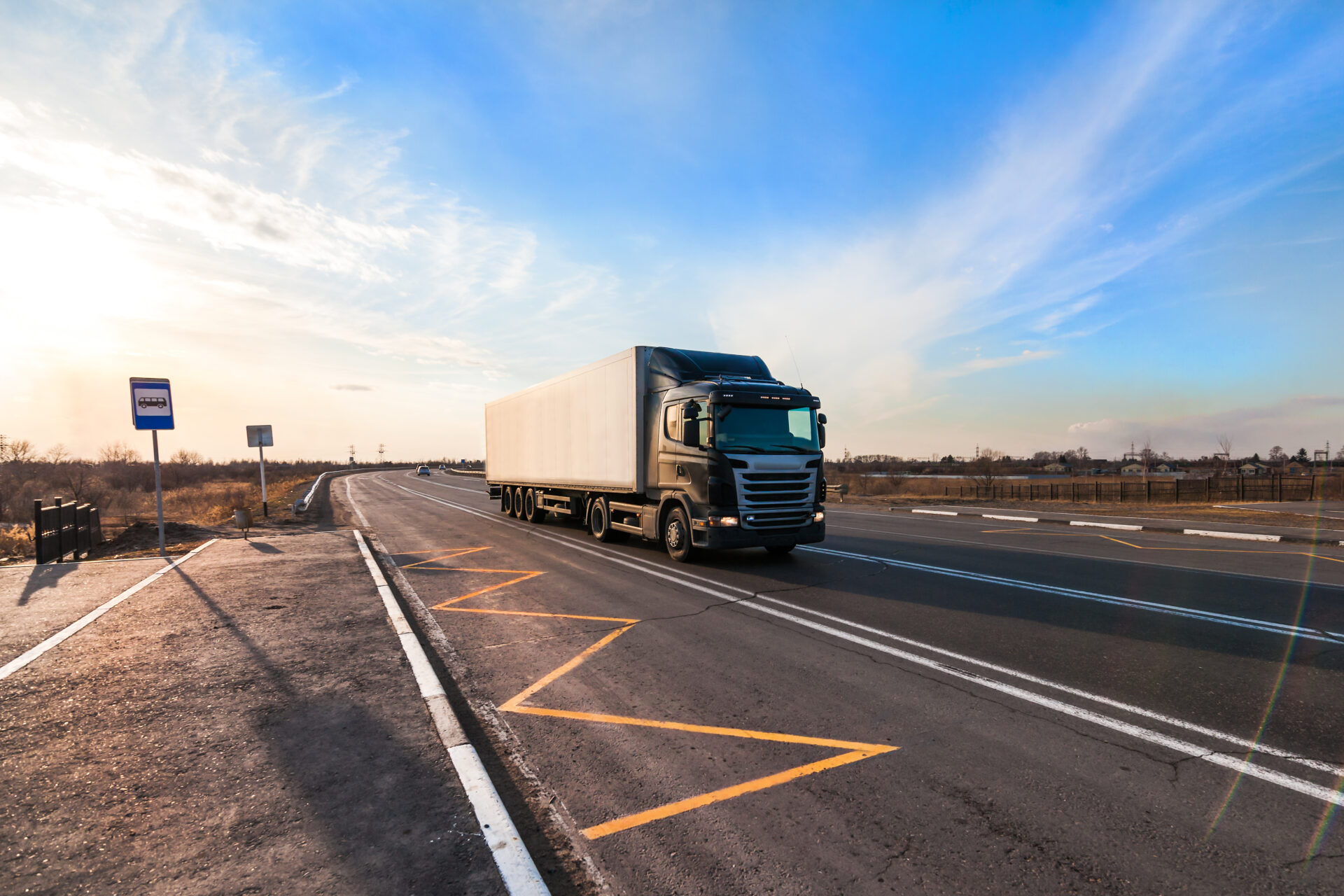 Black truck moving at city's suburb